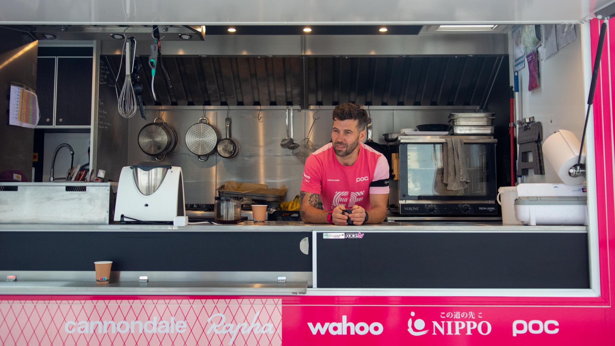 Owen Blandy poses at the front of his mobile kitche for 