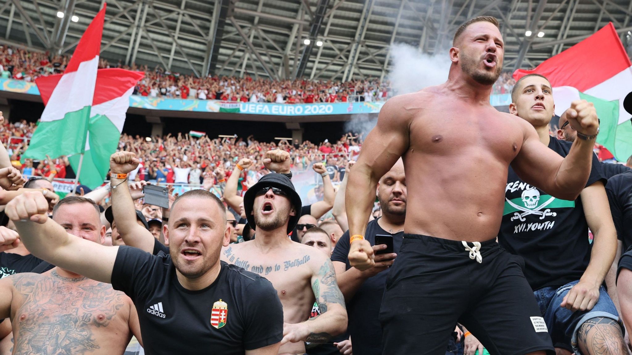 Hungary fans cheer on their team