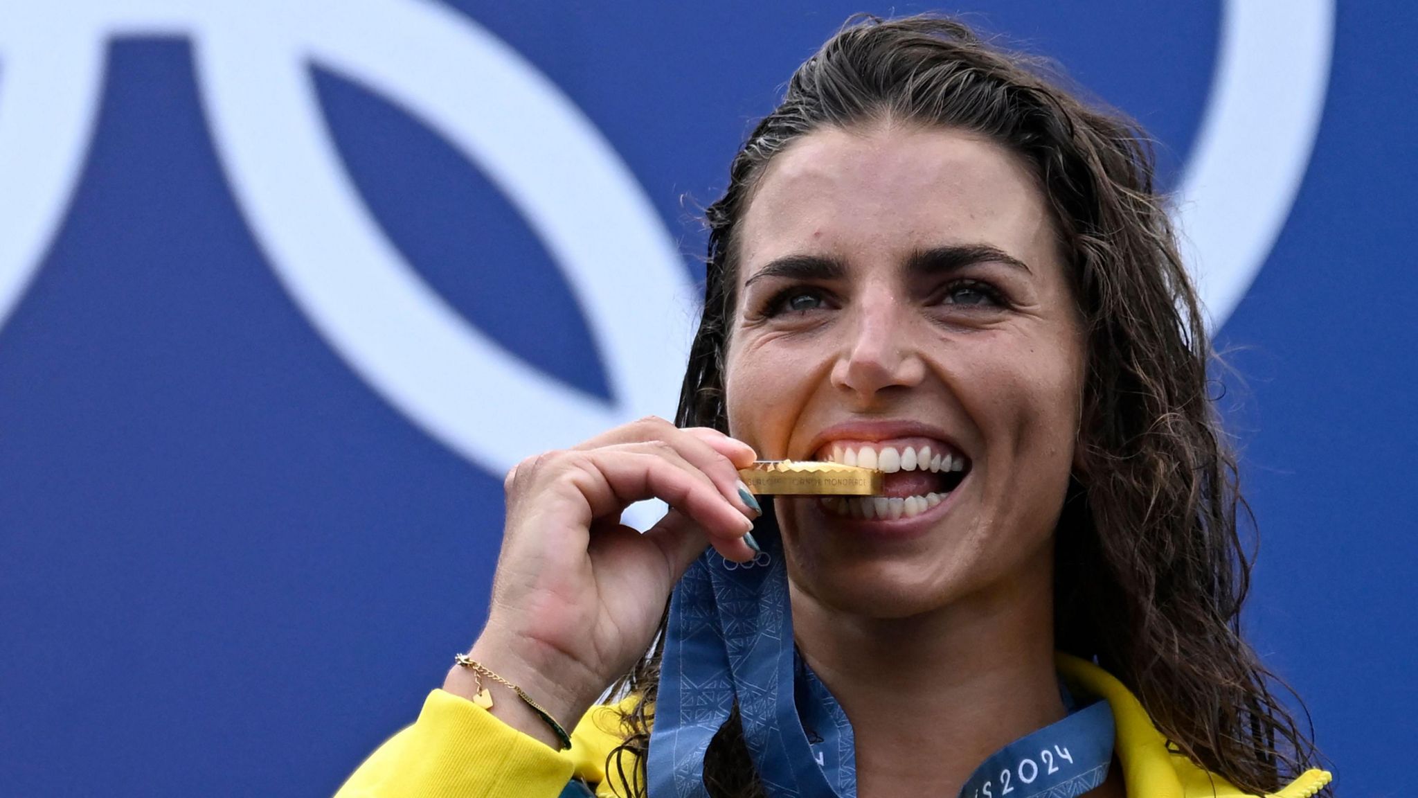 Jessica Fox celebrates with her Olympic gold medal