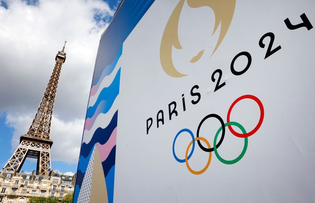 The Paris 2024 logo, representing the Olympic Games is displayed near the Eiffel Tower