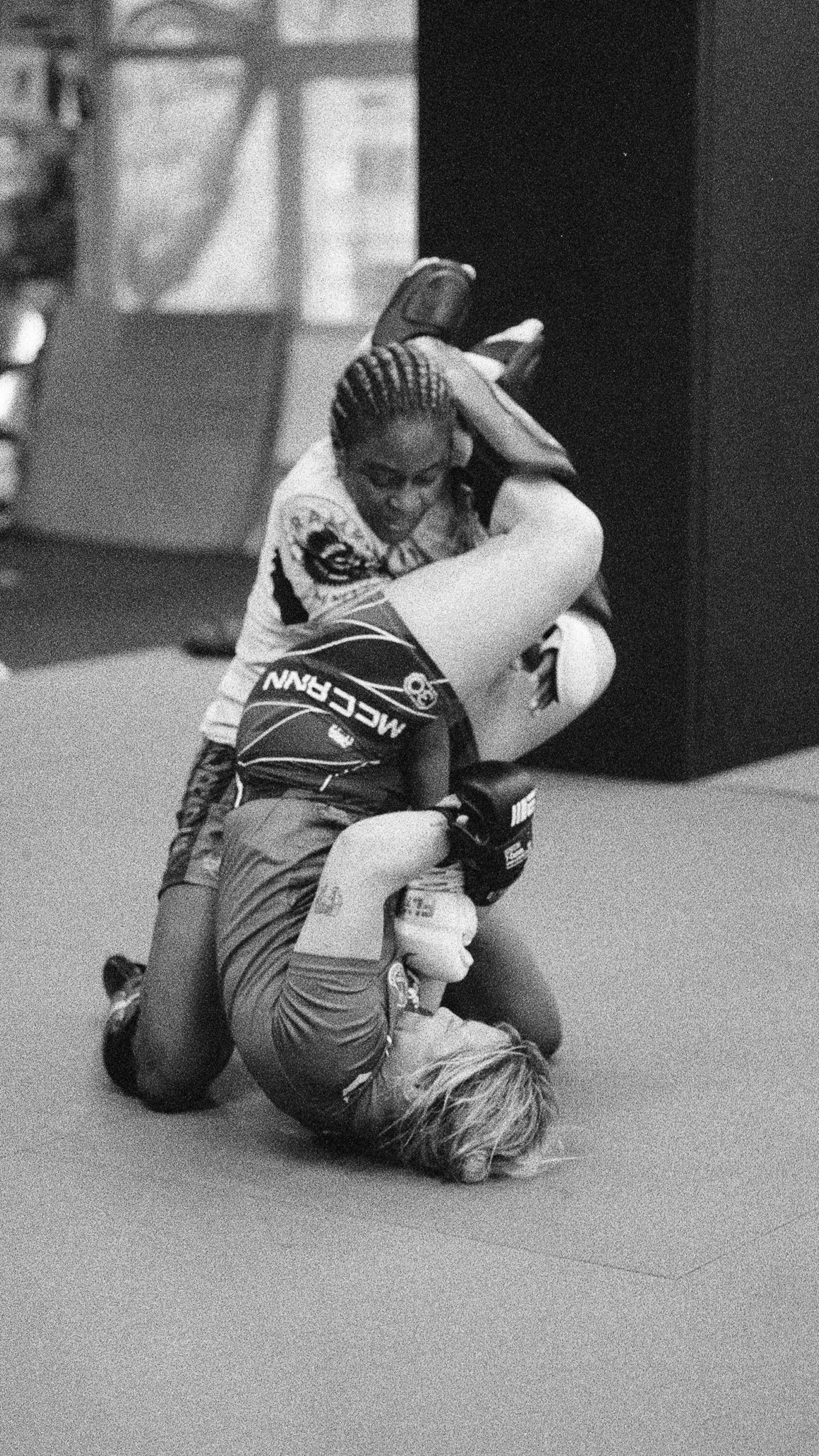 Molly McCann attempts to hold off an opponent while training in Liverpool