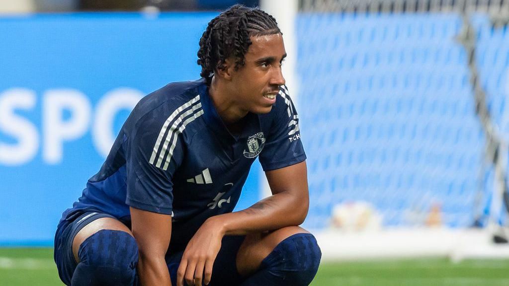 Manchester United defender Leny Yoro crouches down during a pre-season friendly against Arsenal