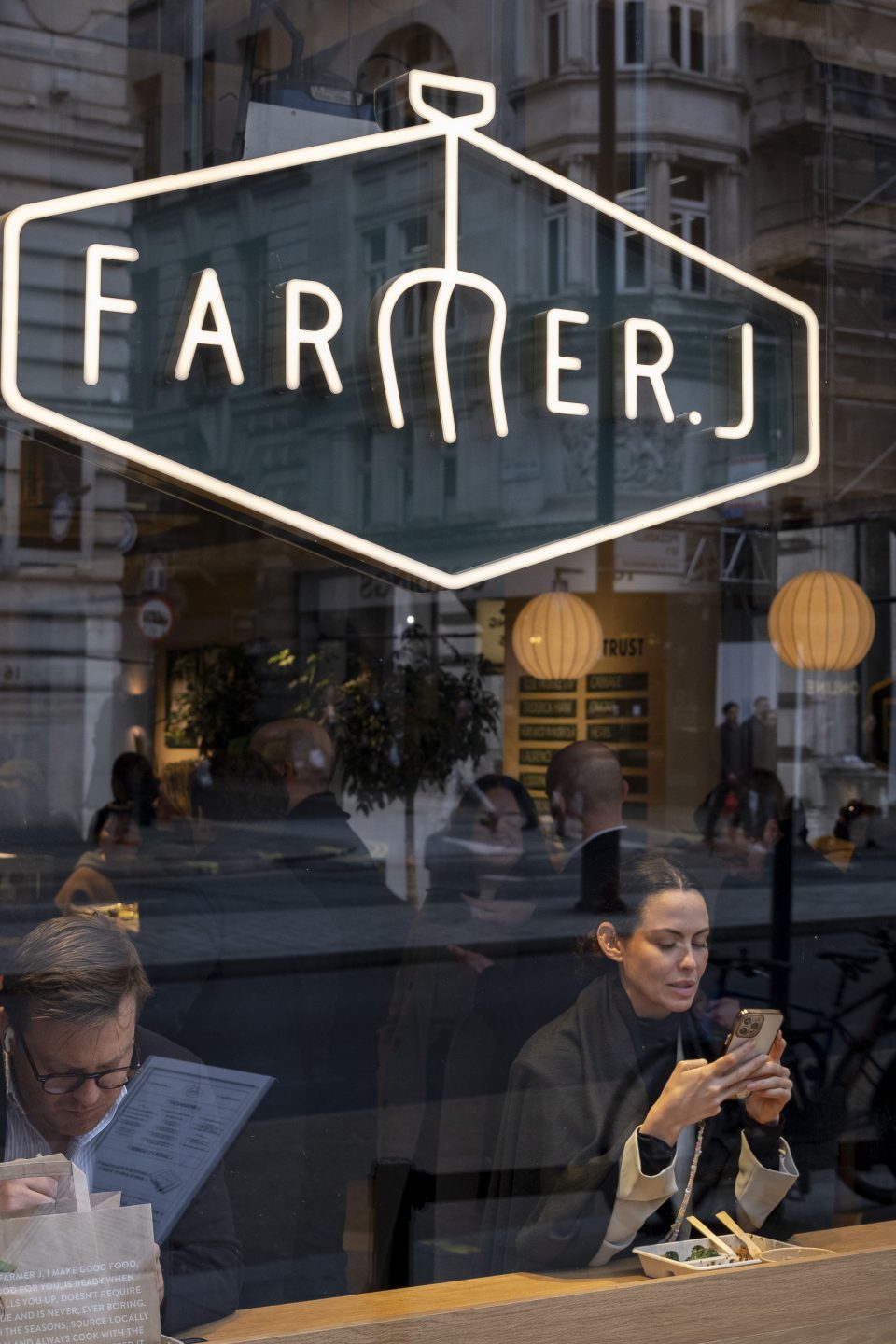 People having lunch in a window seat of a branch of the food chain Farmer J on 5th February 2024 in London, United Kingdom. (photo by Mike Kemp/In Pictures via Getty Images)