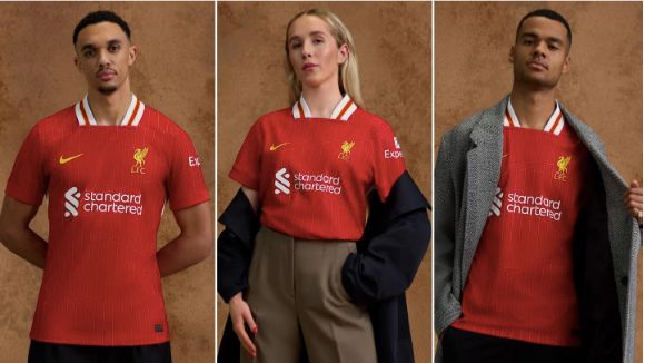 Trent Alexander-Arnold, Missy Bo Kearns and Cody Gakpo model Liverpool's new home shirt.