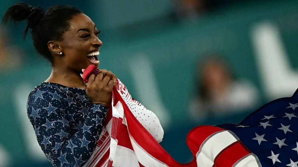 Simone Biles with American flag