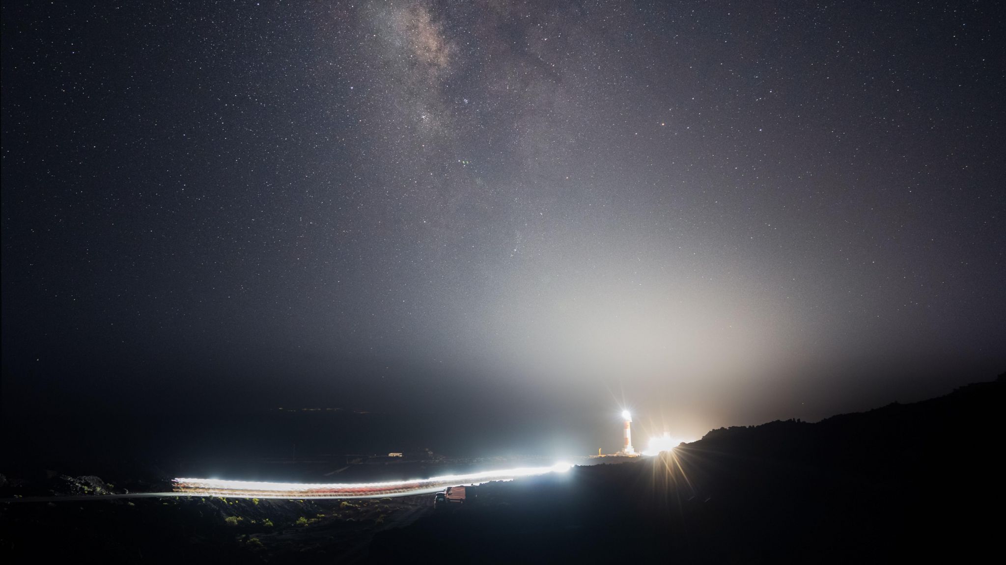 Transvulcania runners start the race with headlamps on under a starry sky