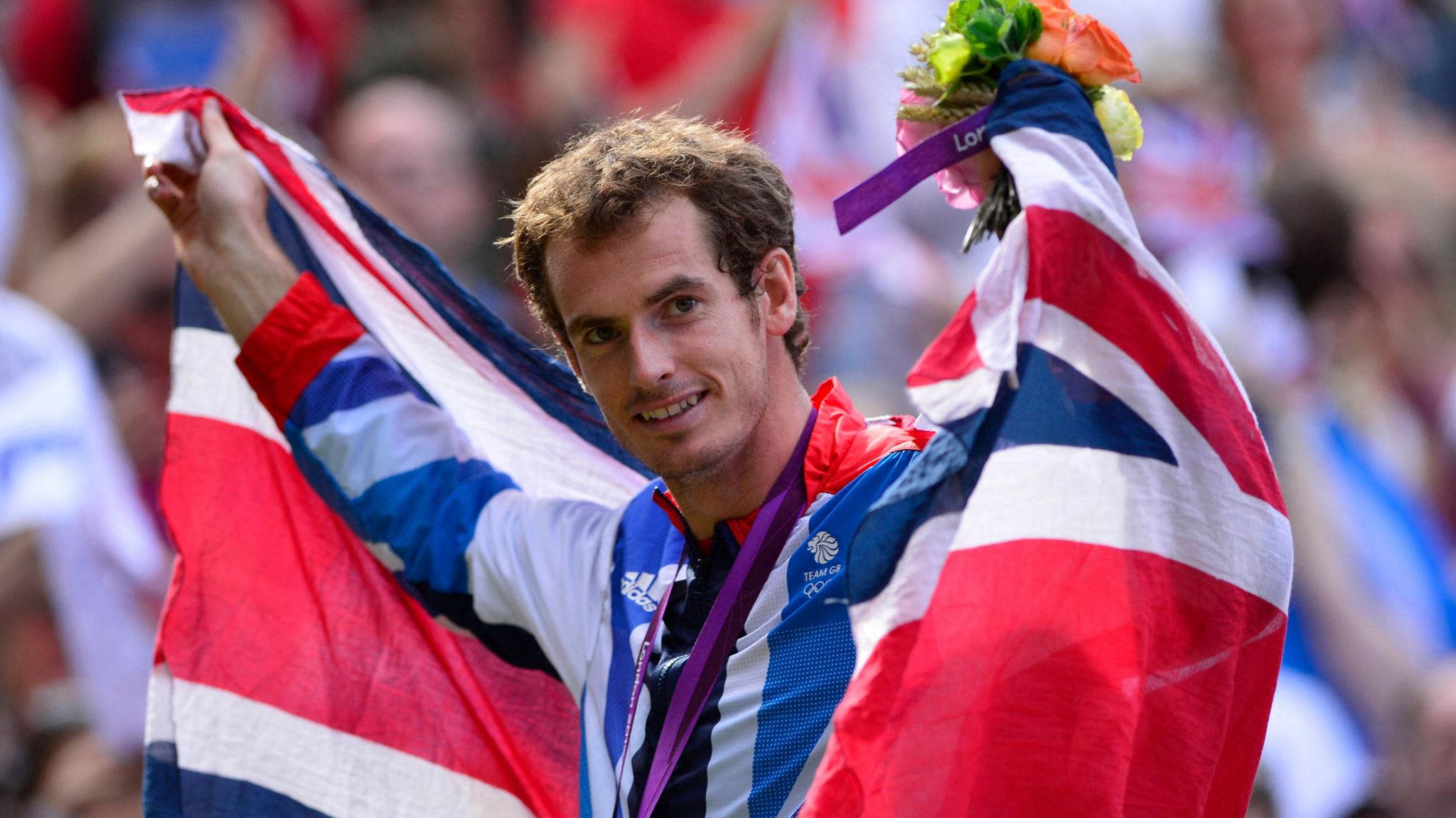 Andy Murray draped in a union flag celebrates his London 2012 singles success