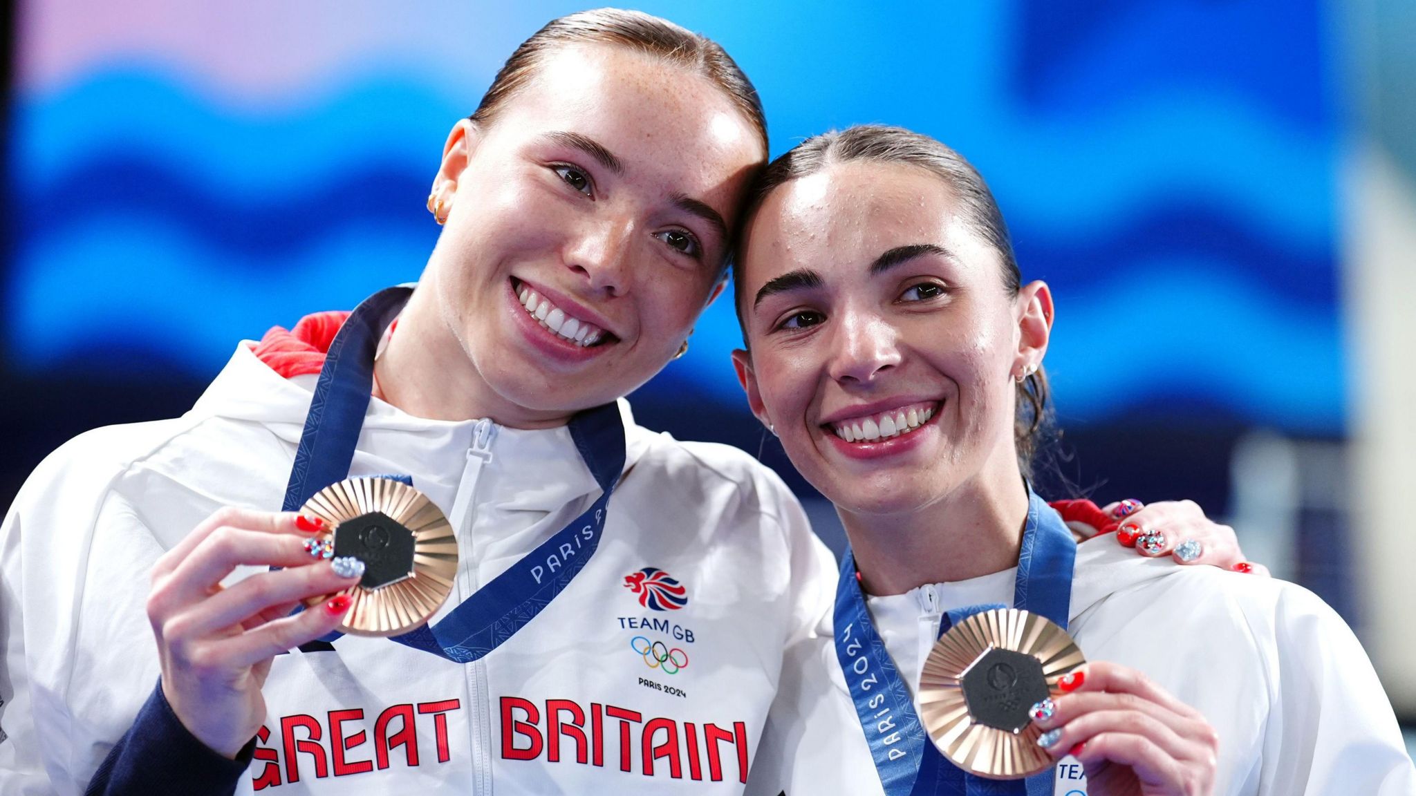 Great Britain's Yasmin Harper and Scarlett Mew Jensen pose with their medals after winning bronze at the Paris 2024 Olympics