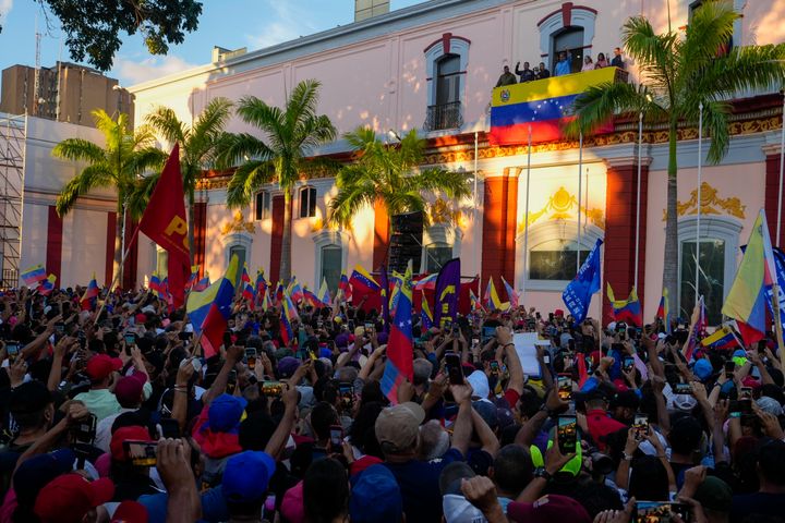 Maduro pumps his first to a crowd of supporters during a speech in defense of his reelection in Caracas on Tuesday.