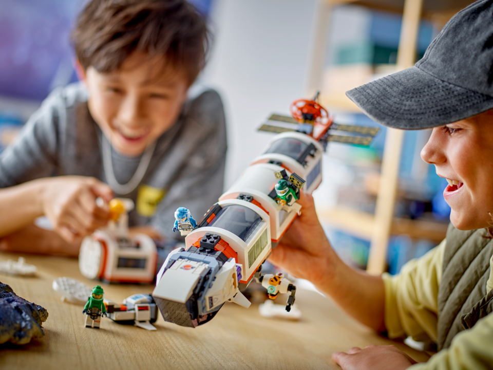 kids playing with Lego set