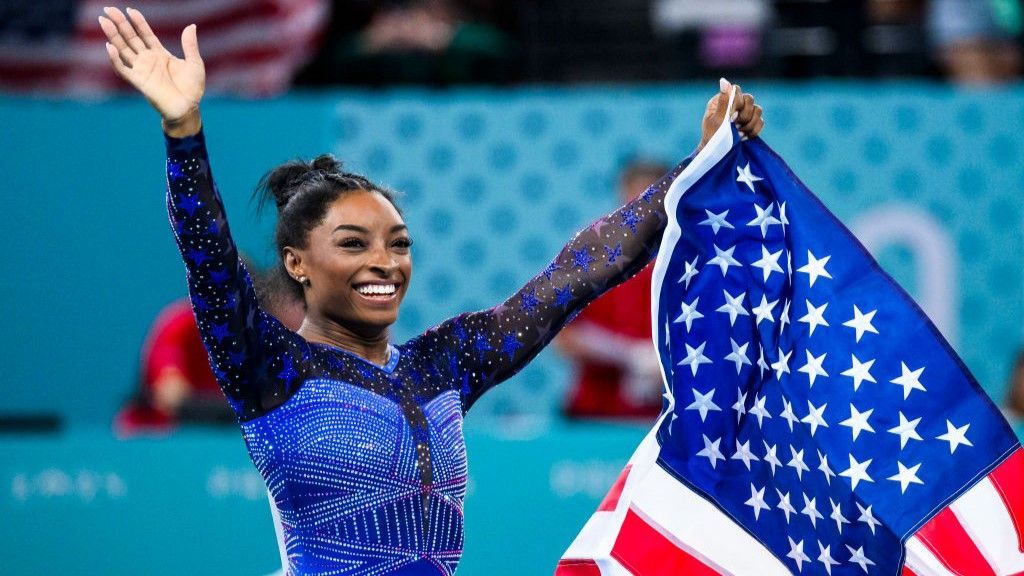 Simone Biles celebrates after winning all-around gold