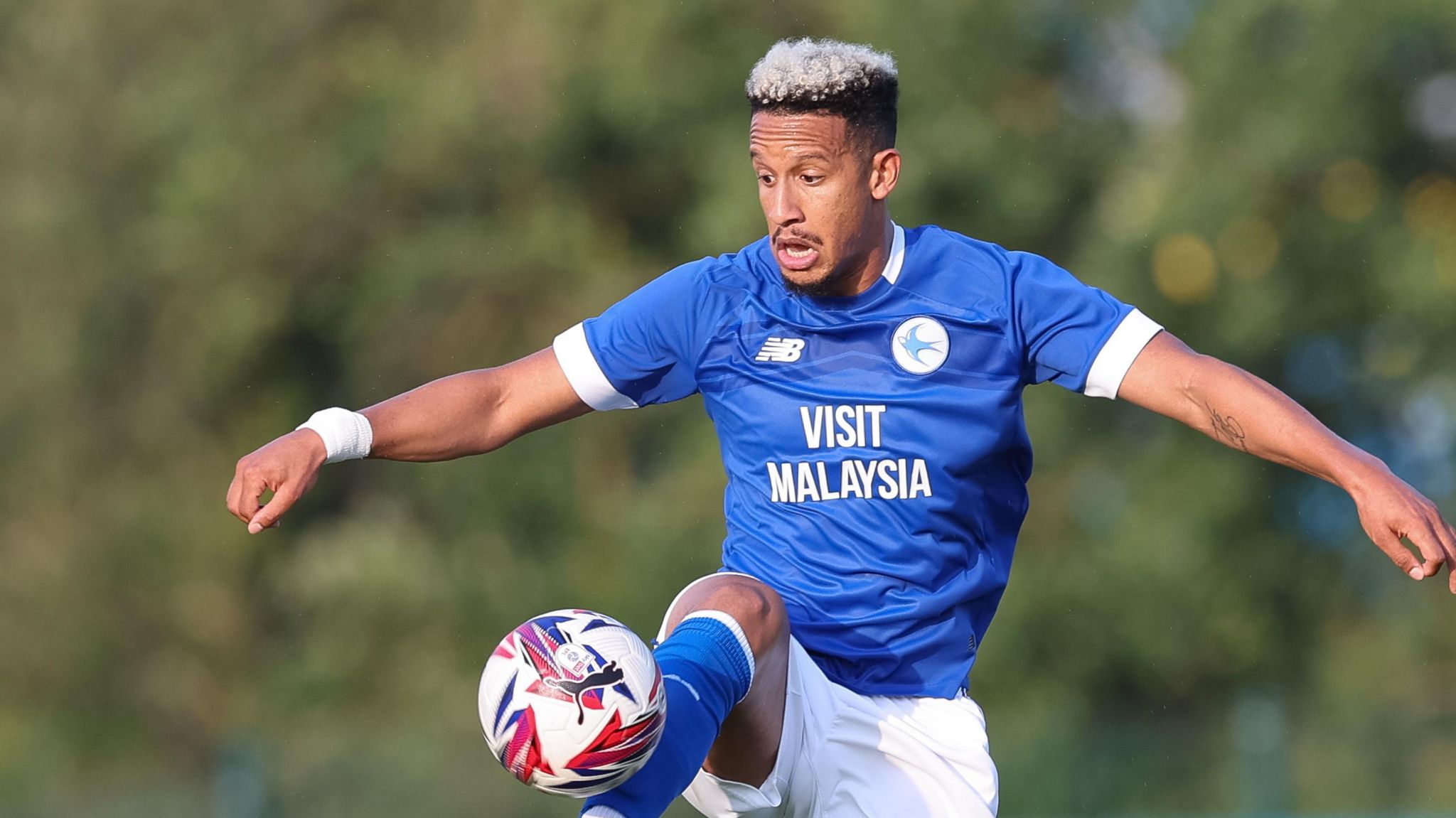 Striker Callum Robinson in pre-season action