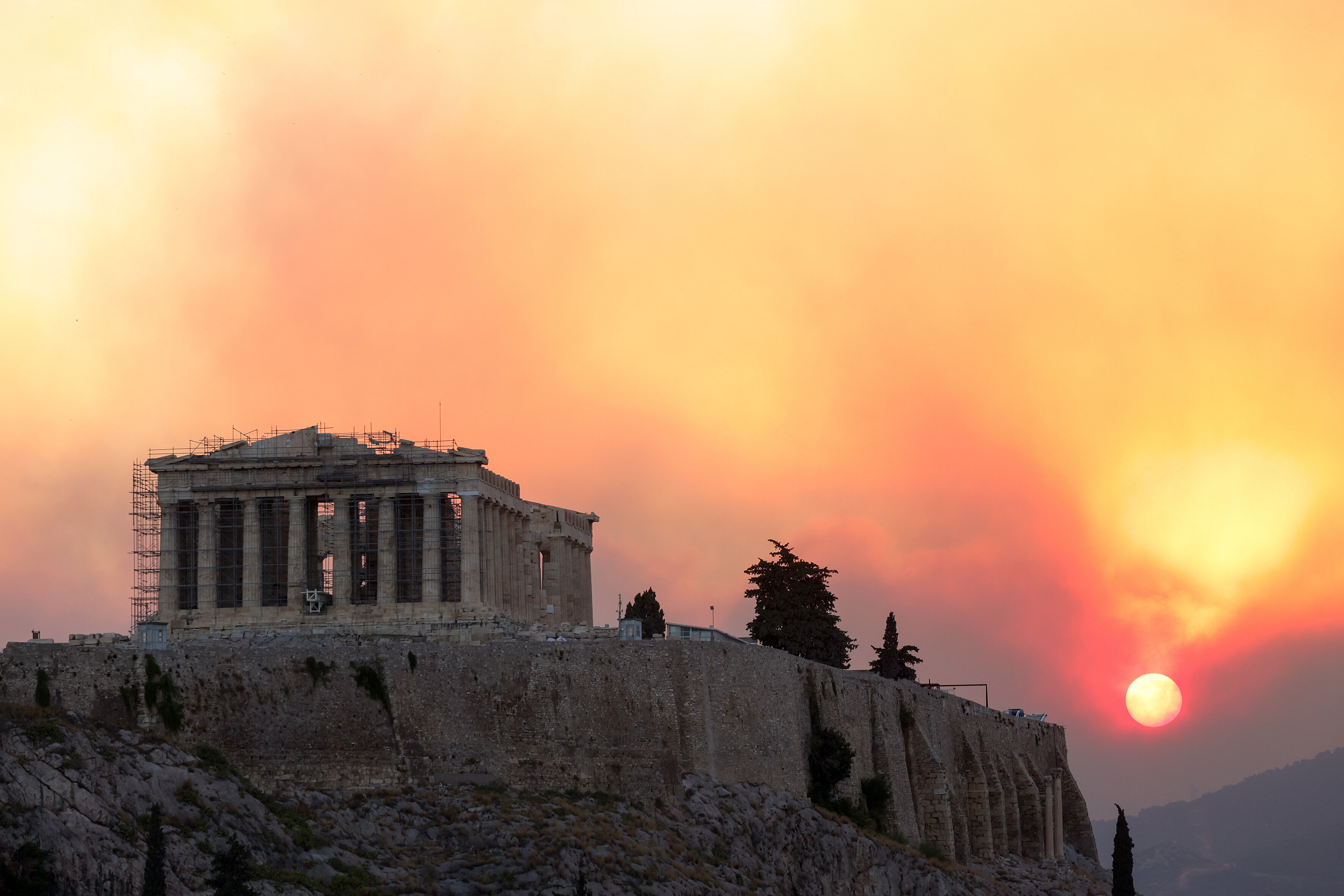 Smoke rises over Parthenon temple during a wildfire near Athens, Greece, on Aug. 12, 2024. 