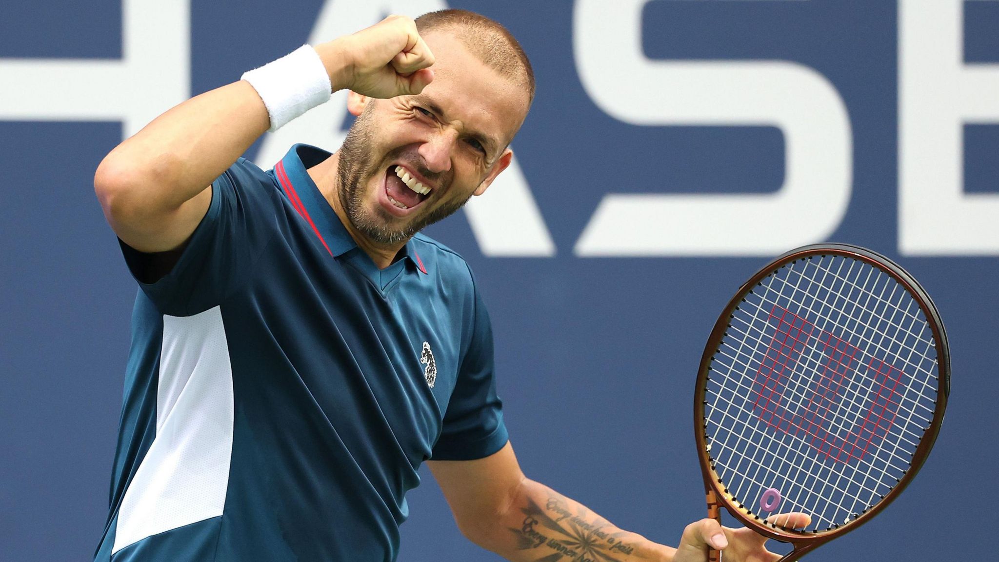 Daniel Evans of Great Britain reacts after a point against Mariano Navone of Argentina