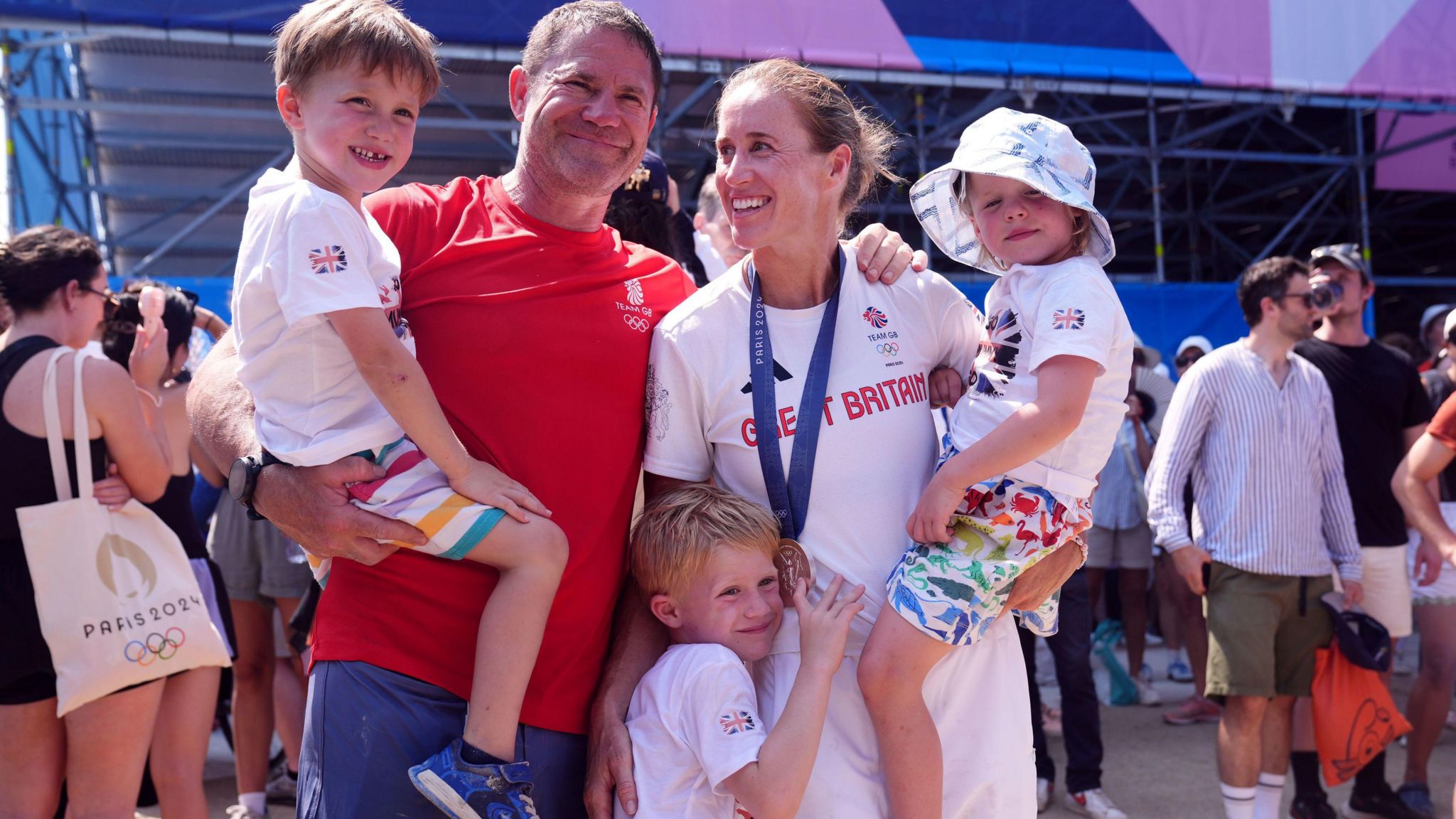 Helen Glover celebrates her medal with her husband and three children