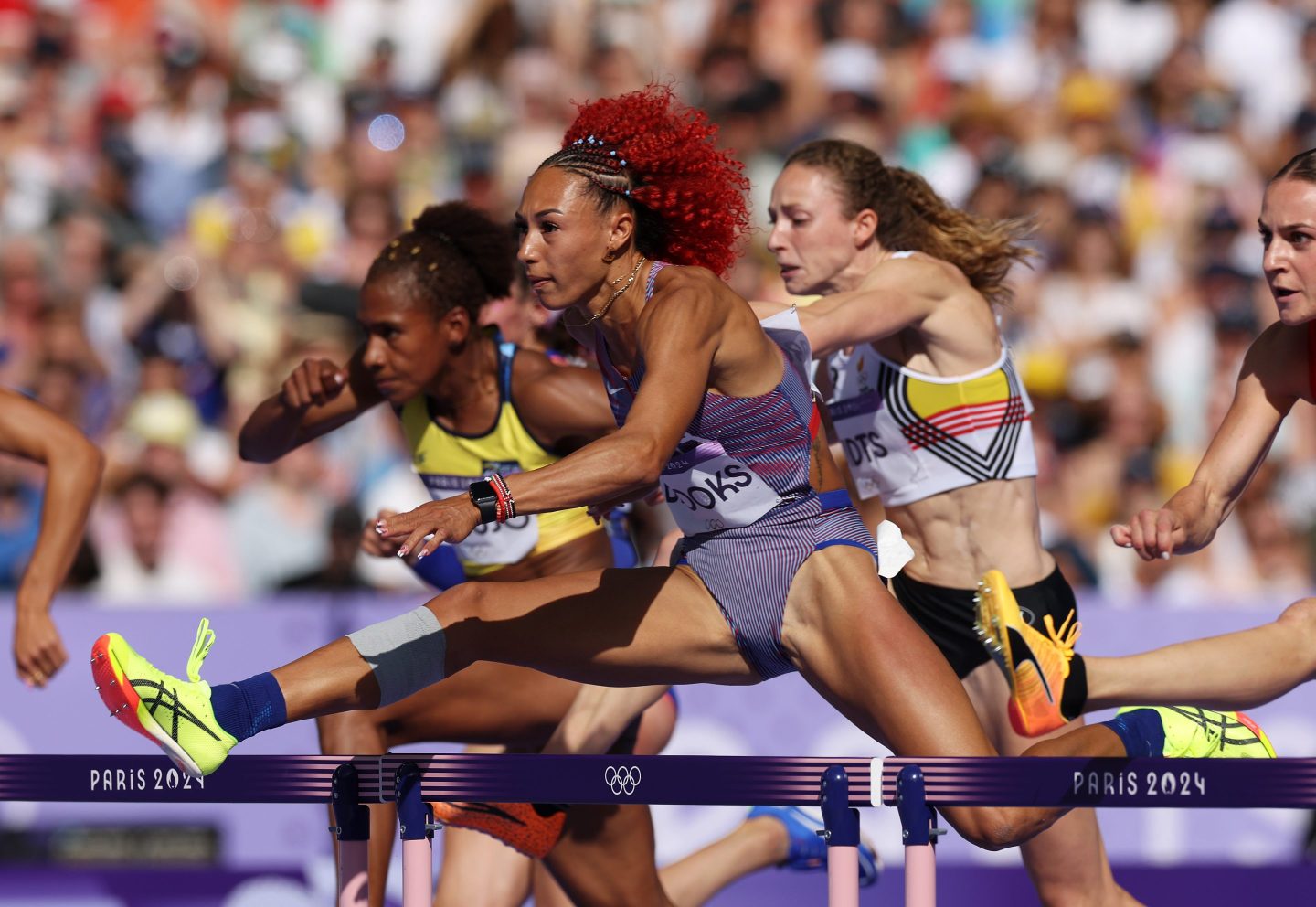 Women in the heptathlon's 100-meter hurdles event in Paris