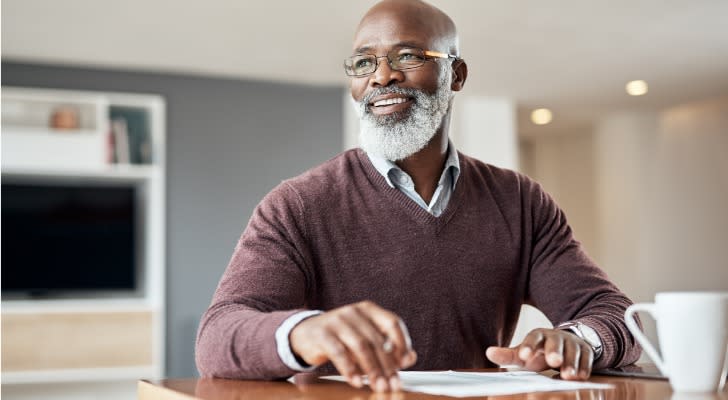 A man thinks about his investment plan for retiring at age 65.