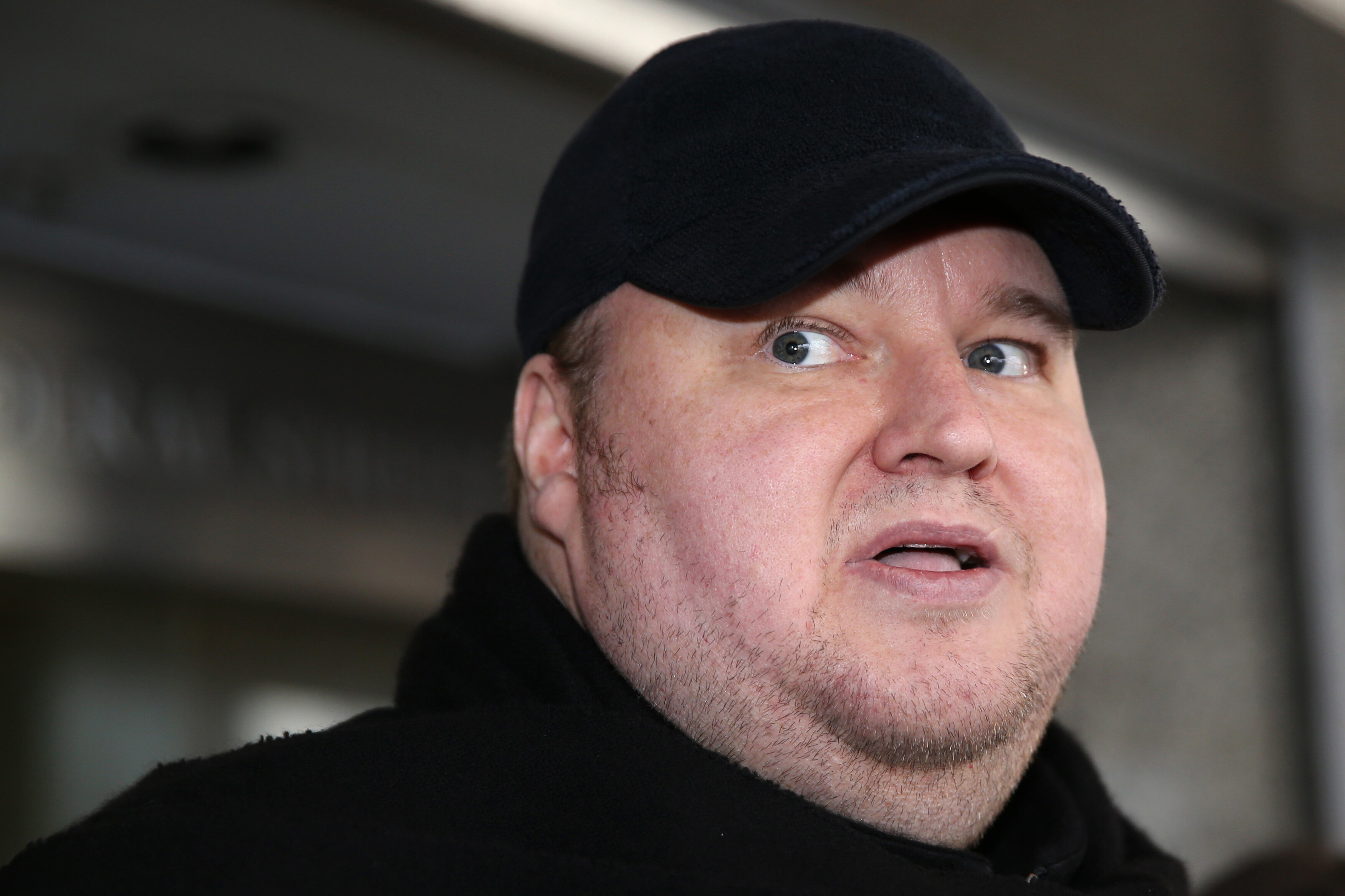 Internet mogul Kim Dotcom leaves court after a judge ruled that he and three other defendants are eligible for extradition to the U.S., in Auckland on Dec. 23, 2015. 