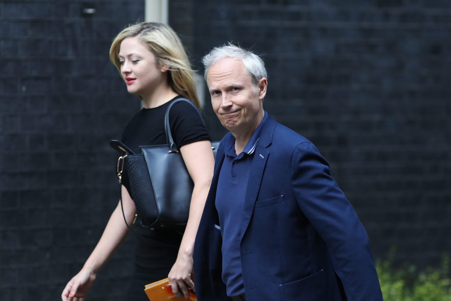 Kathryn Parsons, co-founder of Decoded, left, and Luke Johnson, co-founder of Risk Capital Partners LLP, arrive in Downing Street for a business advisory group meeting in London, U.K., on Thursday, July 20, 2017. U.K. Prime Minister Theresa May will chair the first in a regular series of meetings of the business council in her official Downing Street residence, with discussions due to focus on the terms of the U.K.s withdrawal from the European Union, and wider economic issues such as t§he governments industrial strategy.