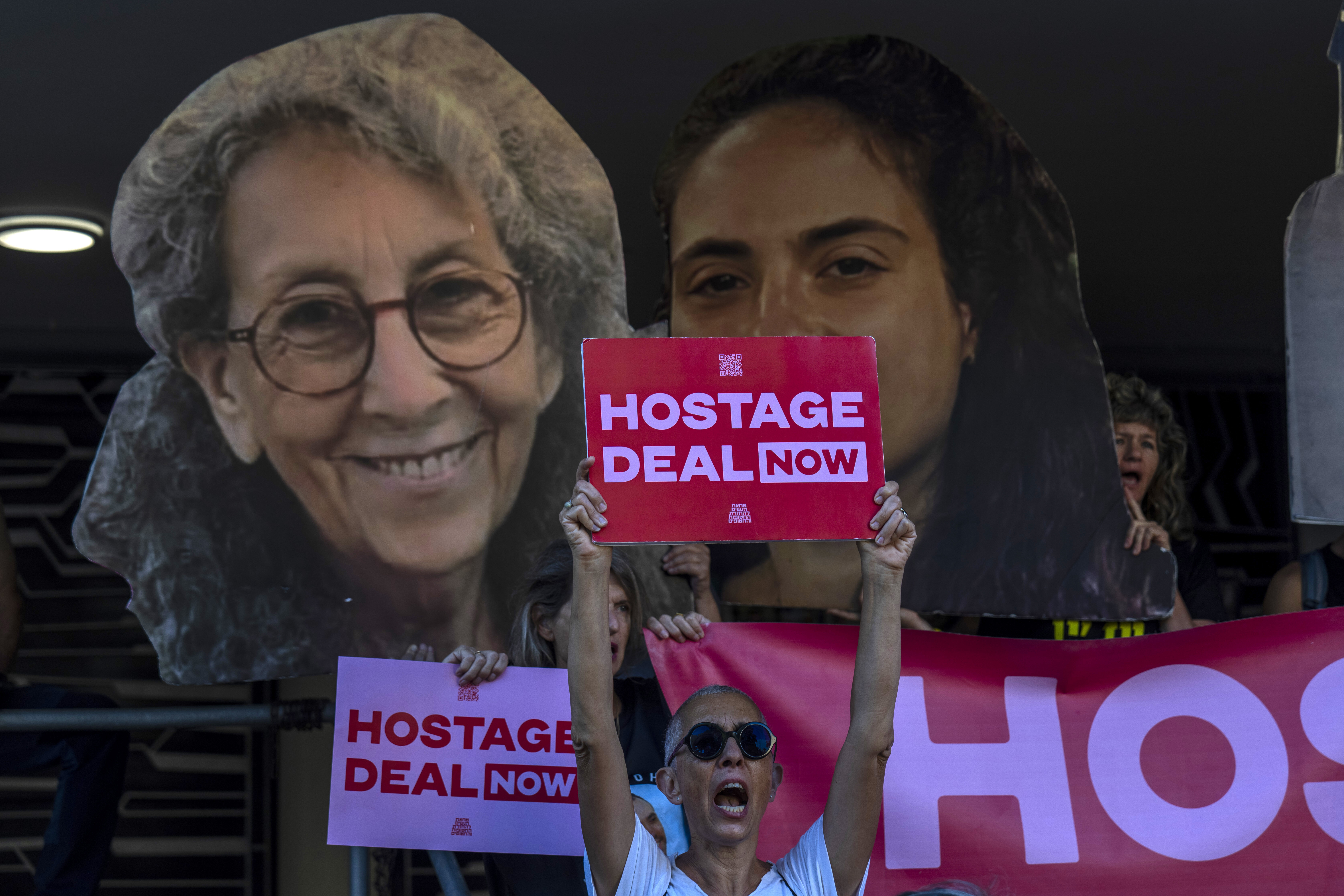 Relatives and supporters of Israeli hostages held by Hamas in Gaza hold photos of their loved ones during a protest calling for their return in Tel Aviv, Israel, on Aug. 15, 2024.