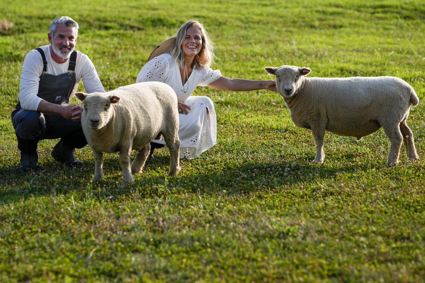 Owners with their babydoll sheep