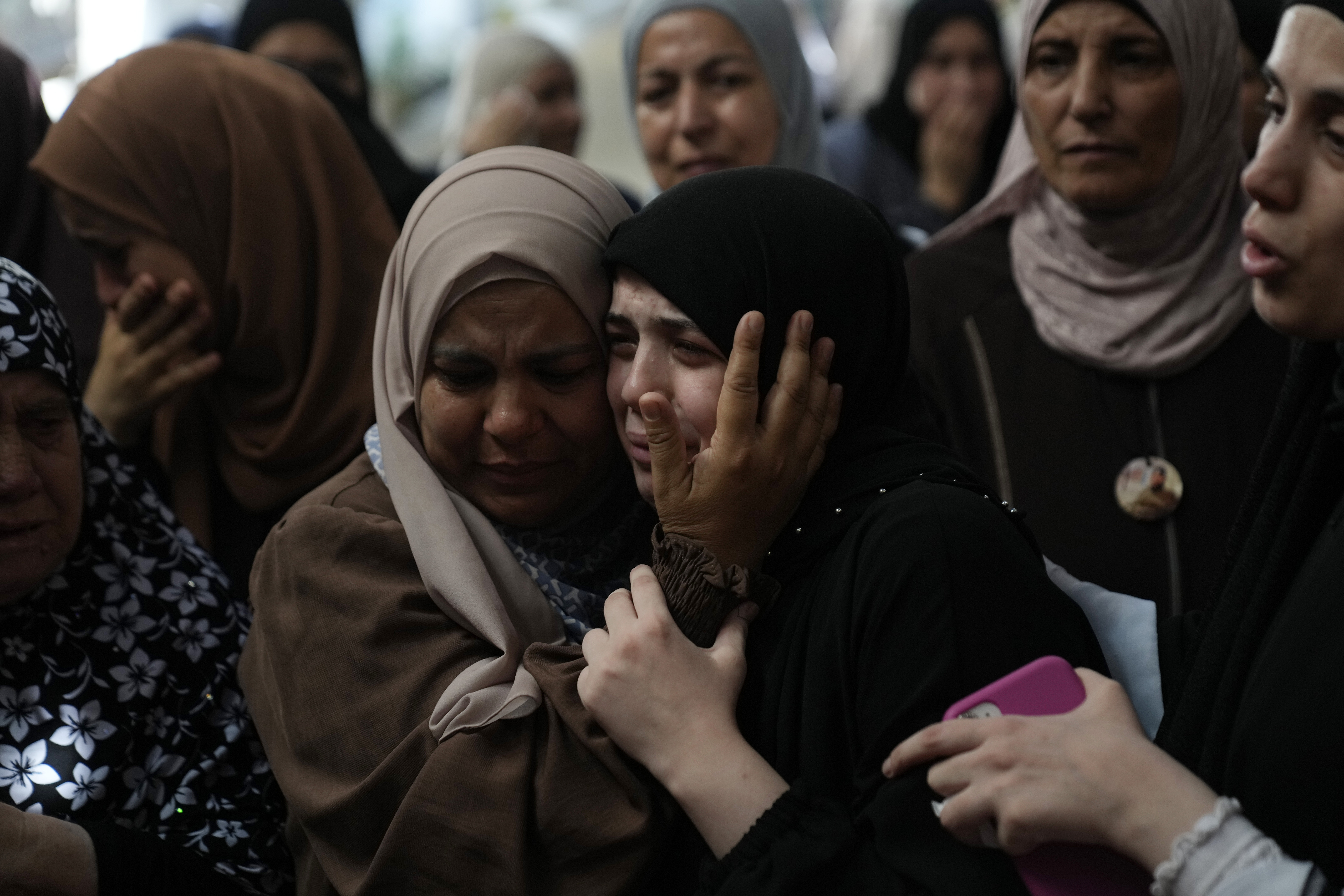 Mourners cry during the funeral of five Palestinians who were killed by an Israeli military airstrike in the northern occupied West Bank, in the refugee camp of Nur Shams, Tulkarem, on Aug. 27, 2024.