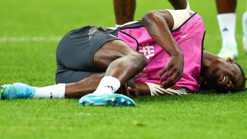 Eduardo Camavinga lies in pain on the ground