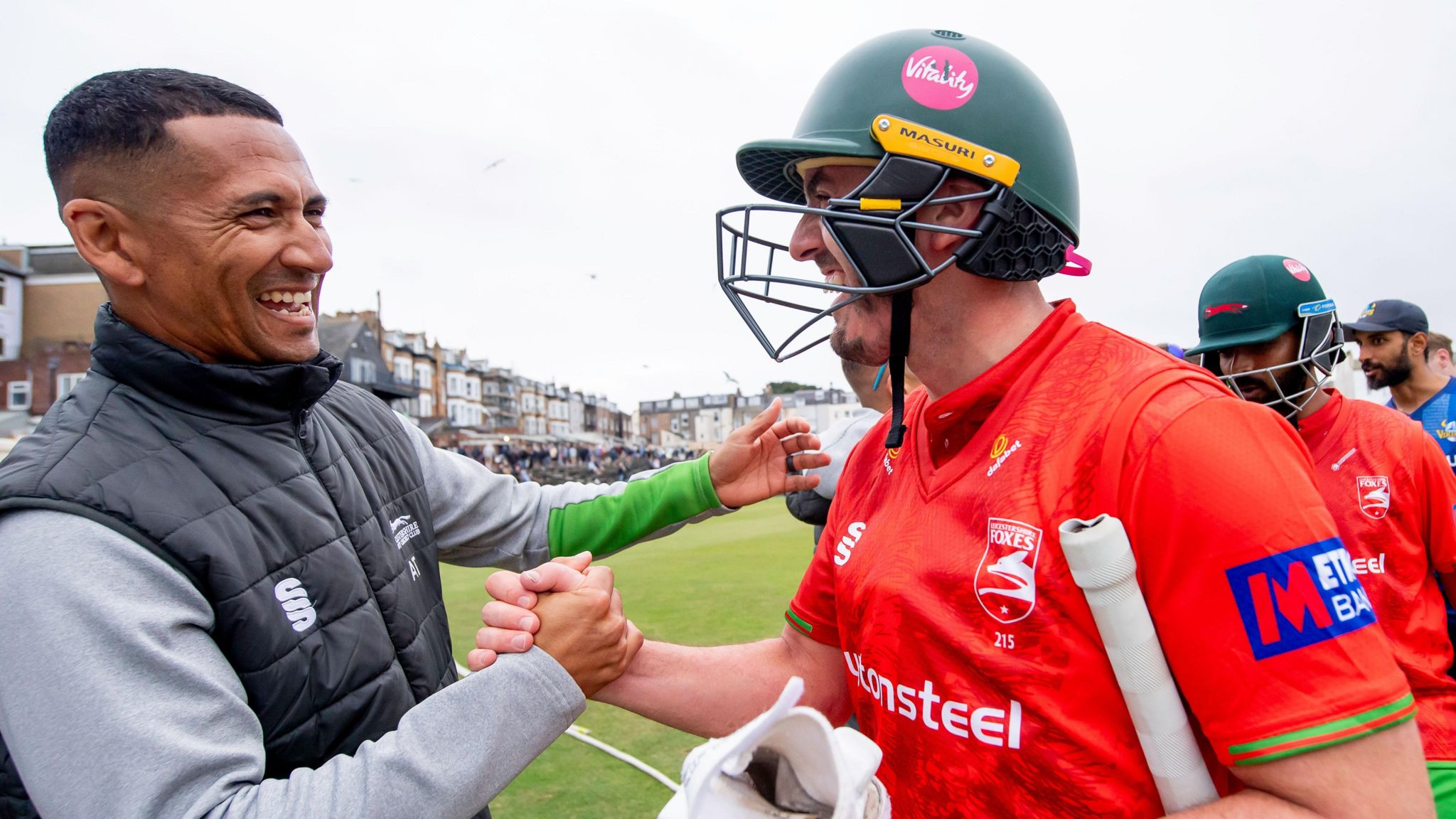 Lewis Hill is congratulated by coach Alfonso Thomas after Leicestershire's One-Day Cup win at North Marine Road,Scarborough 