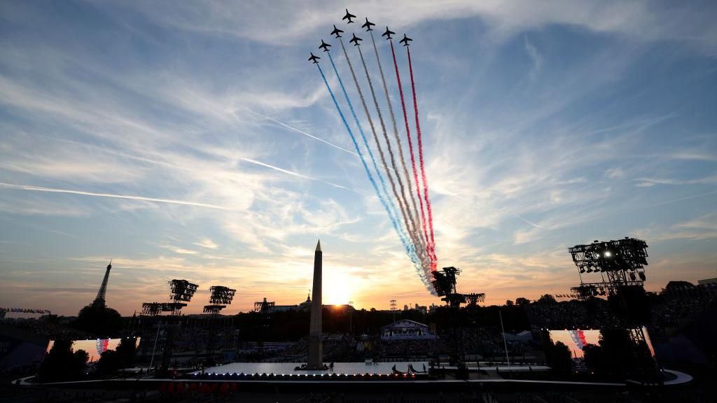 The Patrouille de France release smoke in the colours of the French flag 