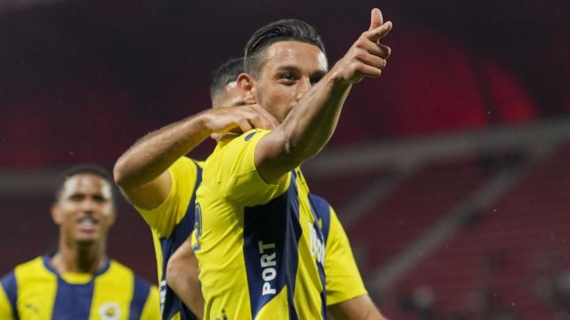 Irfan Can Kahveci celebrates scoring for Fenerbahce by mimicking a shooting pose