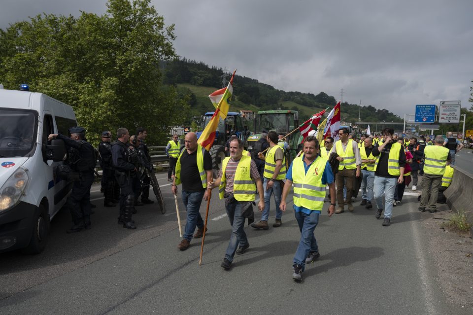 BIRIATOU, FRANCE - JUNE 03: Spanish farmers march on the highway to block the French-Spanish border at Biriatou during a farmers protest on June 03, 2024 in Biriatou, France. Farmers are demanding better working conditions and a reduction in fuel taxes. (Photo by Gari Garaialde/Getty Images)