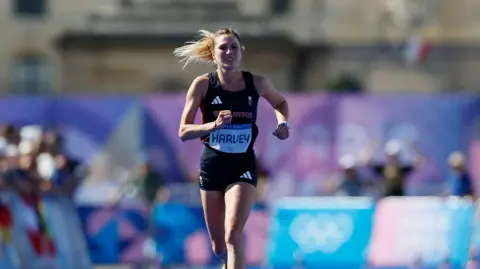 Reuters Rose Harvey of Great Britain running towards the finish line at the Women's Marathon at the Paris Olympics. 