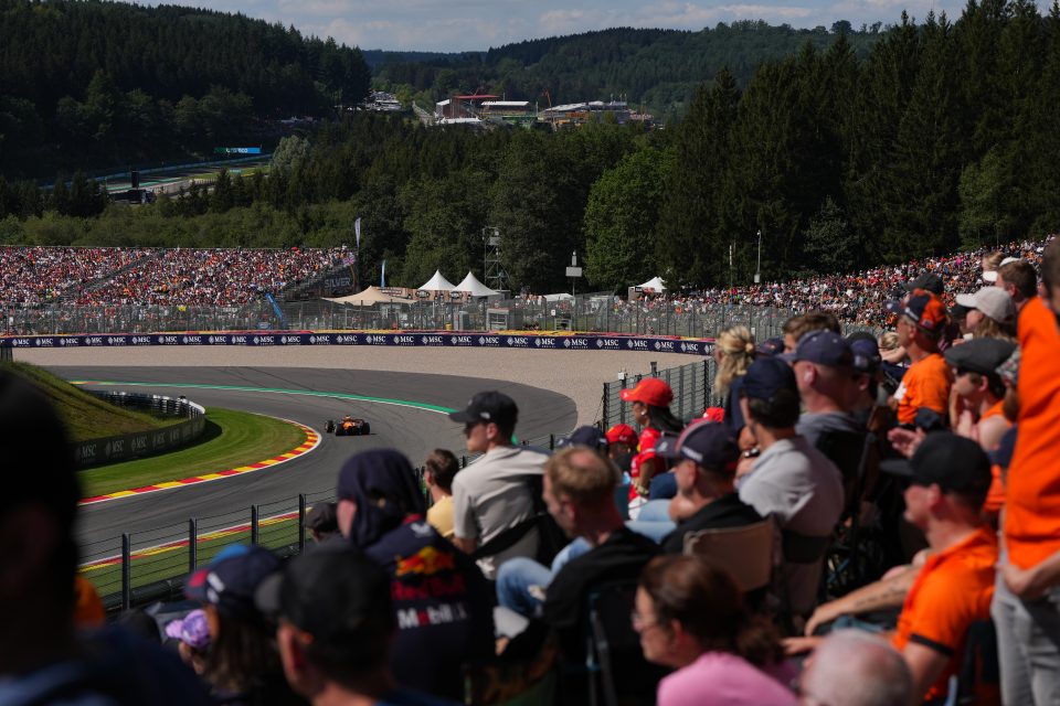 spectators watching an f1 race track