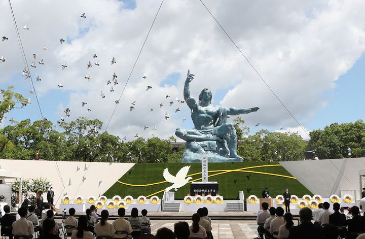 Doves fly during a memorial service for victims of the U.S. atomic bombing at the Nagasaki Peace Park in Nagasaki on Aug. 9, 2021.