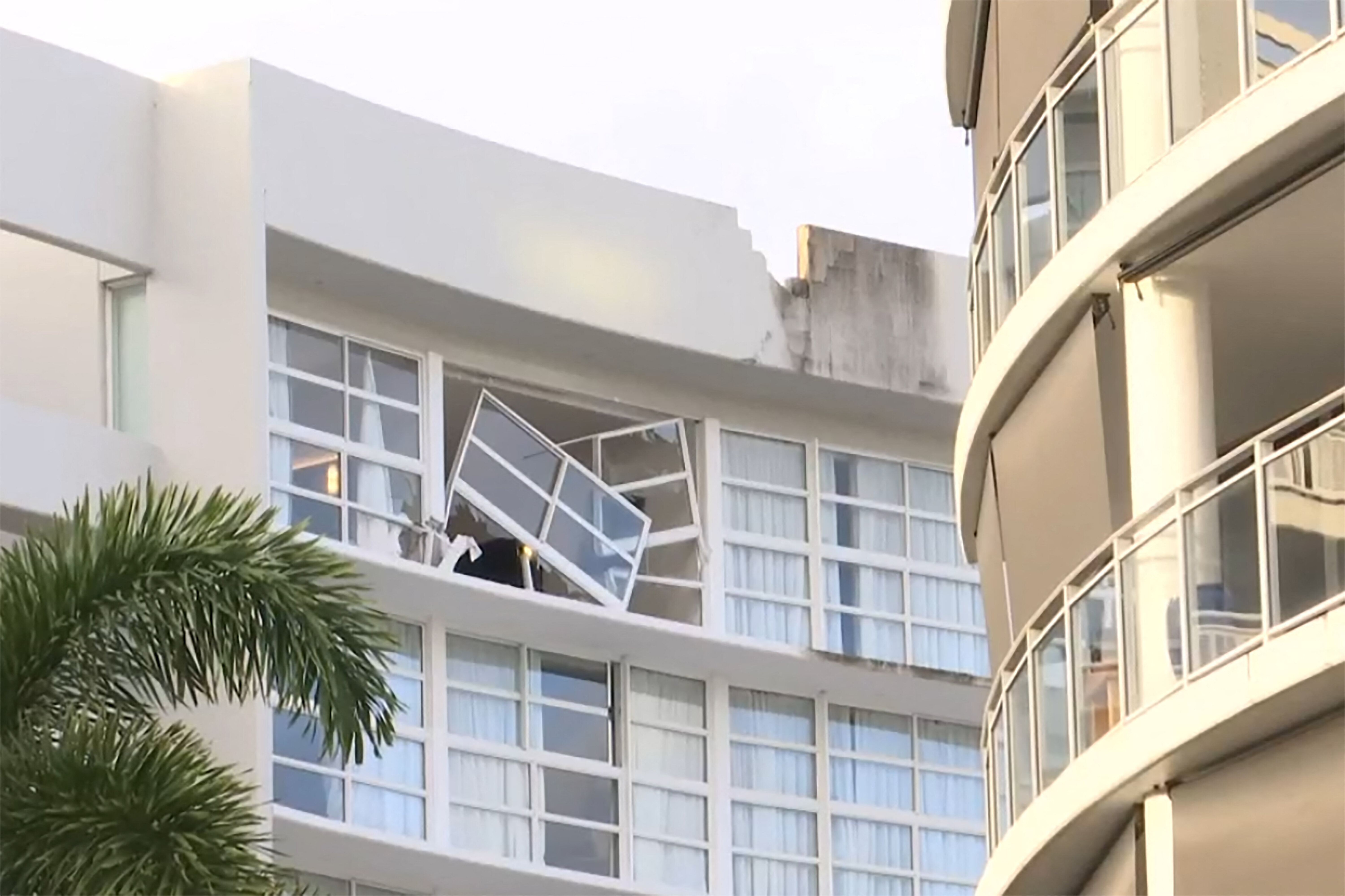 This screengrab taken from video footage provided by Australian Broadcasting Corporation (ABC) on Aug. 12, 2024, via AFPTV shows the damage after a helicopter crashed into the roof of a Hilton hotel in Cairns.