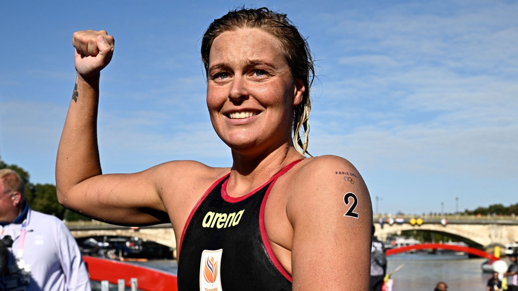 Netherlands' Sharon van Rouwendaal celebrates her victory after winning the women's 10km marathon swimming final