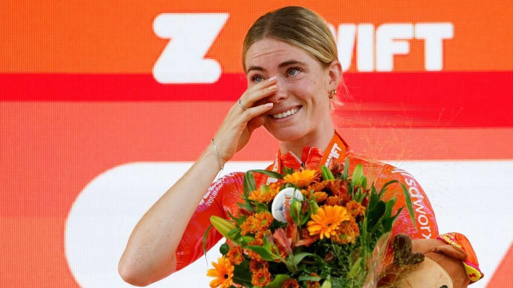 Dutch cyclist Demi Vollering wipes a tear as she celebrates winning stage three of the 2024 Tour de France Femmes