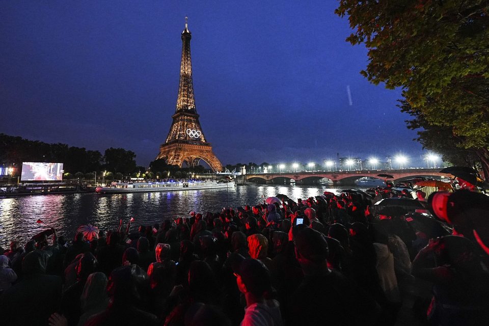 Lights illuminate the Eiffel Tower during the opening ceremony of the Paris 2024 Olympic