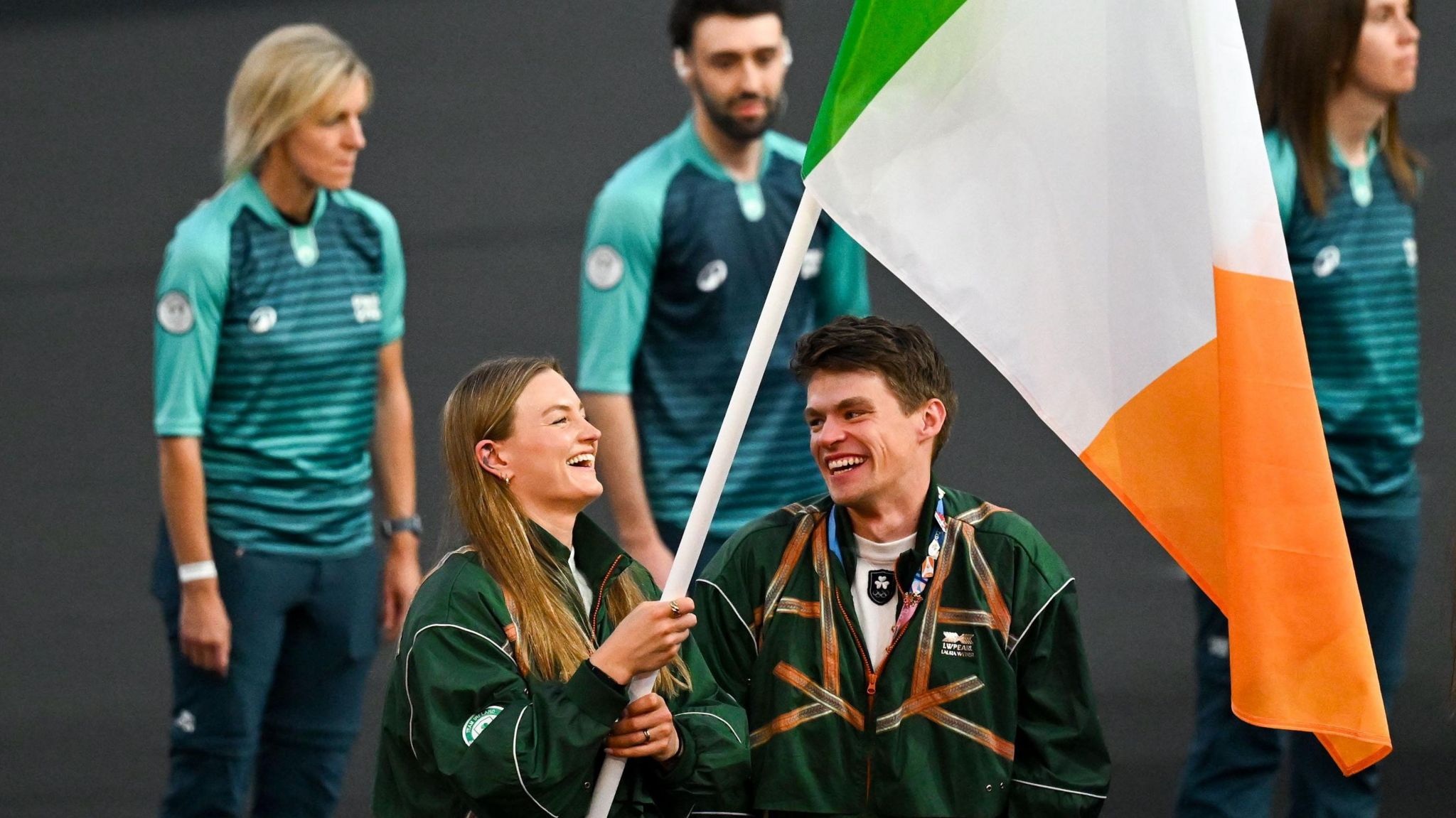 Ireland flagbearers Mona McCarthy and Fintan McCarthy laugh during the Olympic Games closing ceremony