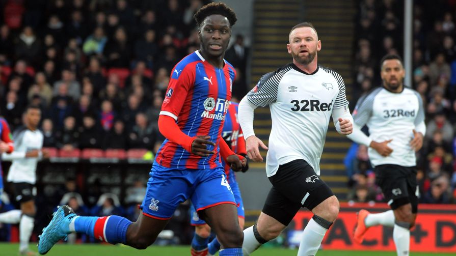 Brandon Pierrick pictured with Wayne Rooney during Crystal Palace's FA Cup third round tie with Derby County in 2020