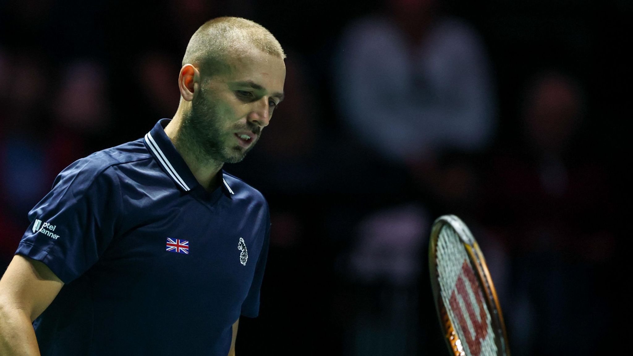 Dan Evans throws his racquet in frustration during the Davis Cup defeat against Argentina's Tomas Martin Etcheverry