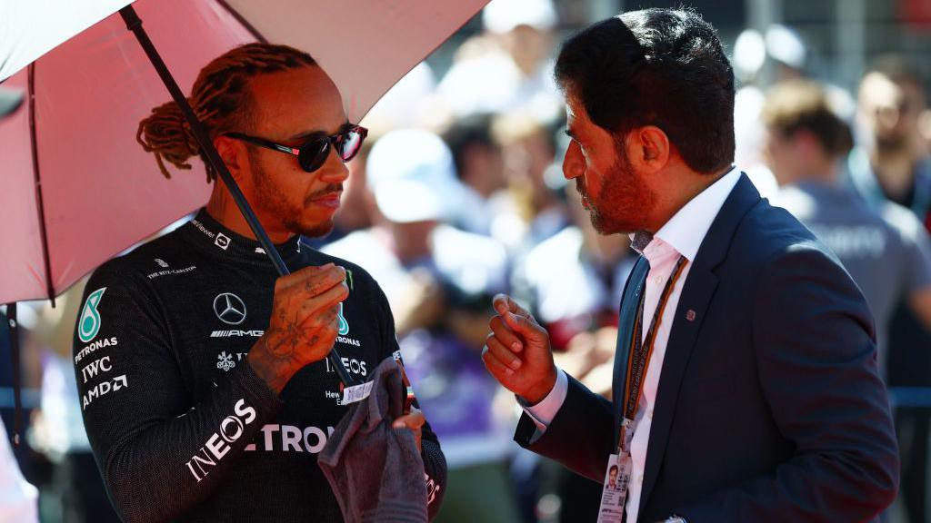 Lewis Hamilton speaks to FIA president Mohammed ben Sulayem on the grid in Baku in 2022 