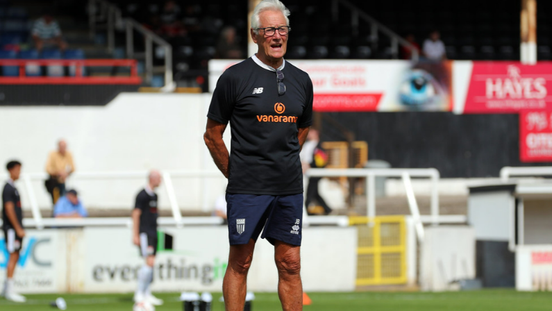 Assistant manager Jim Barron on the pitch before a Bath City match