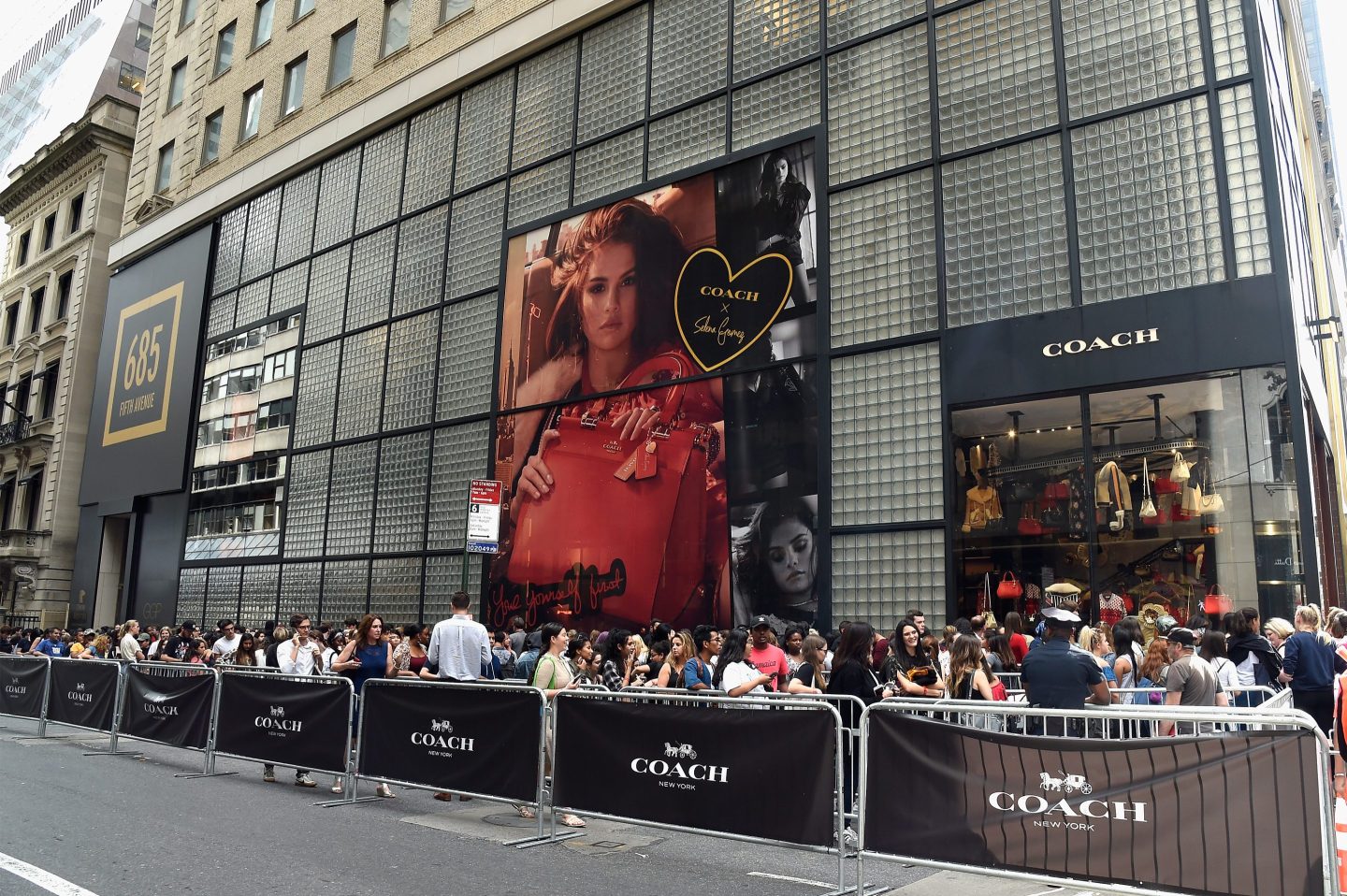 Fans crowd outside the store the Coach In-Store Event with Selena Gomez.