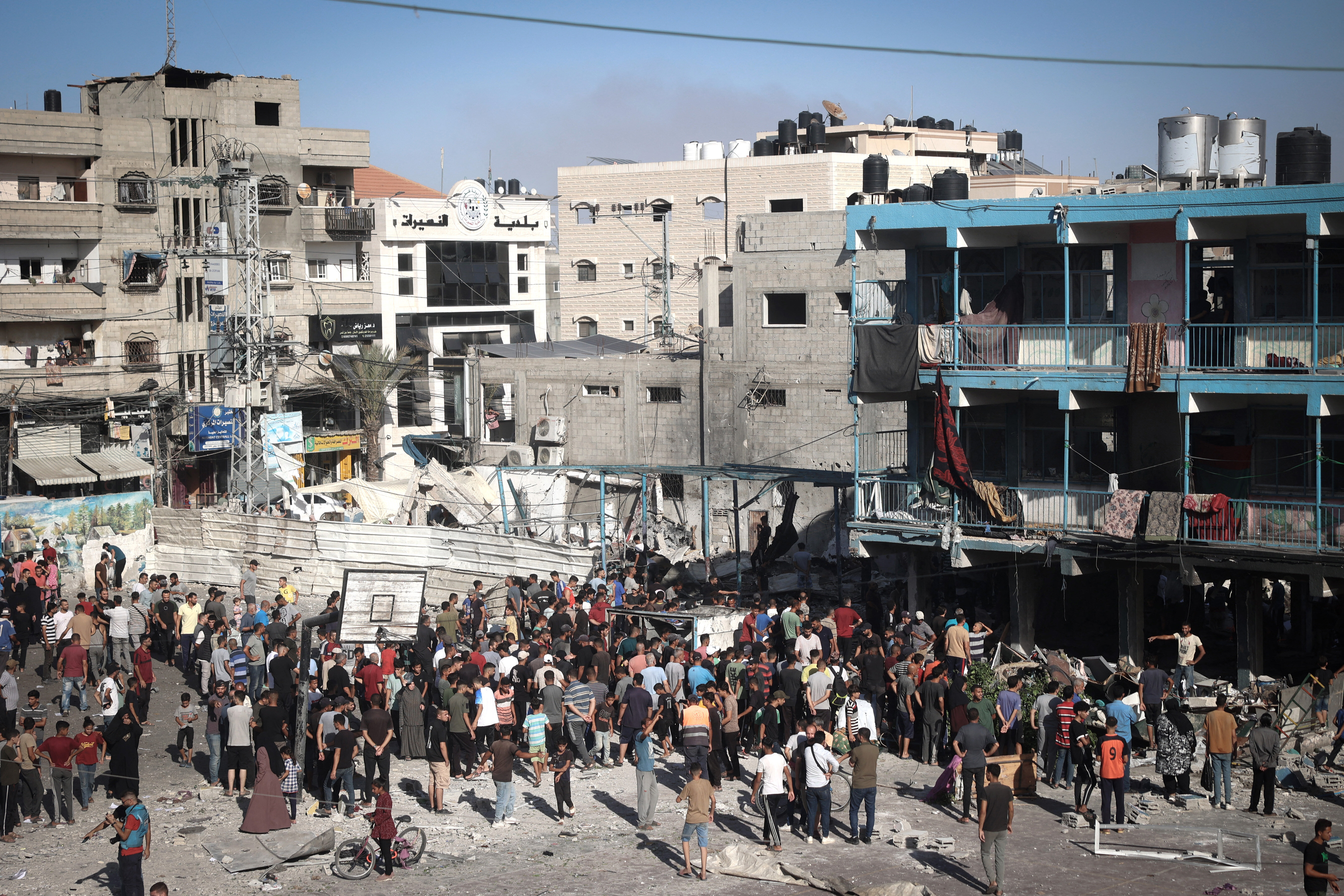 Palestinians stand in the courtyard of a school after an Israeli air strike hit the site, in Nuseirat in the central Gaza Strip on September 11, 2024. (Photo by EYAD BABA/AFP via Getty Images)