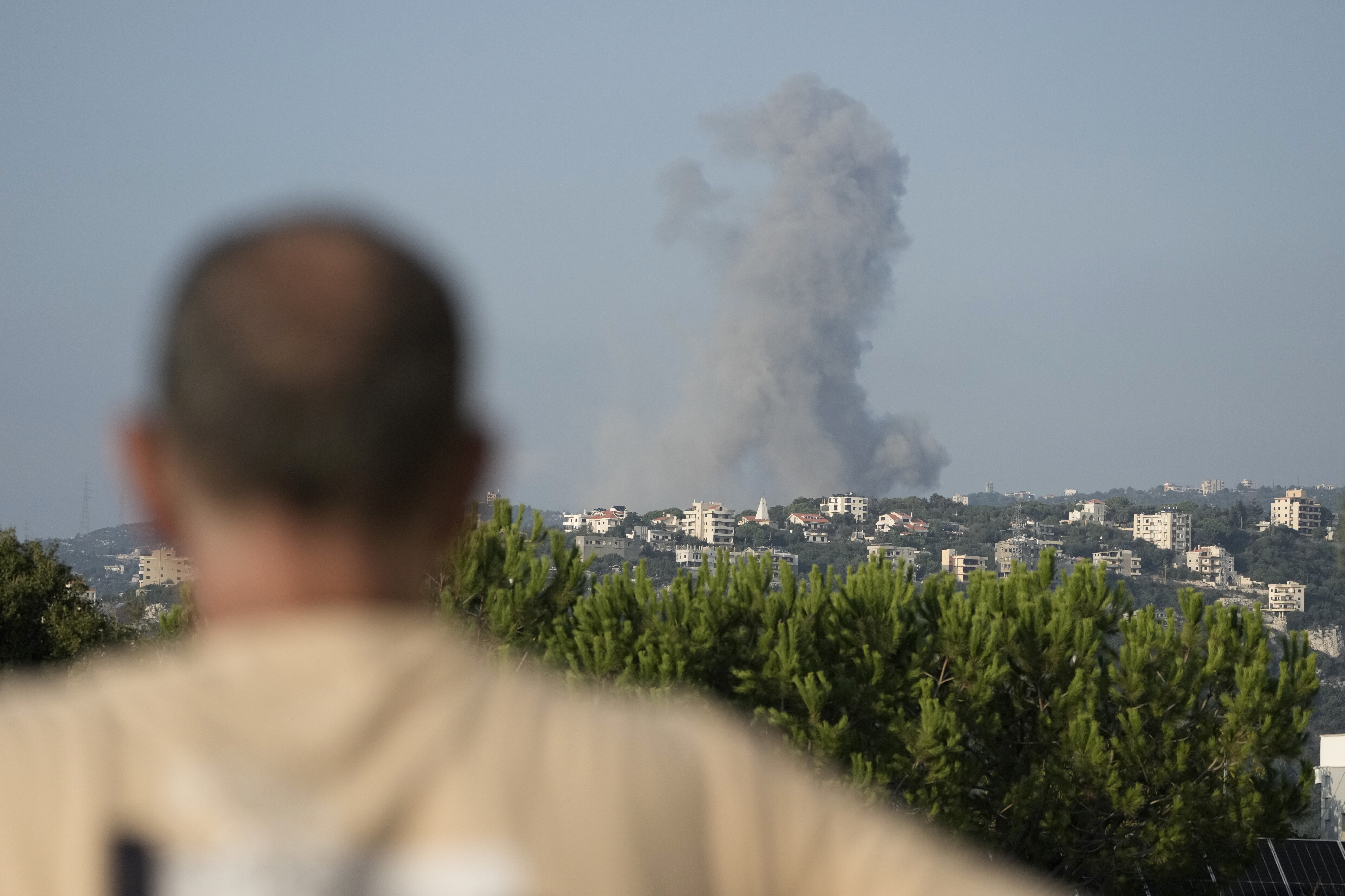 Smoke rises from an Israeli airstrike north of Beirut, in the village of Ras Osta, Byblos district, seen from Maaysrah, Lebanon, on Sept. 25, 2024.