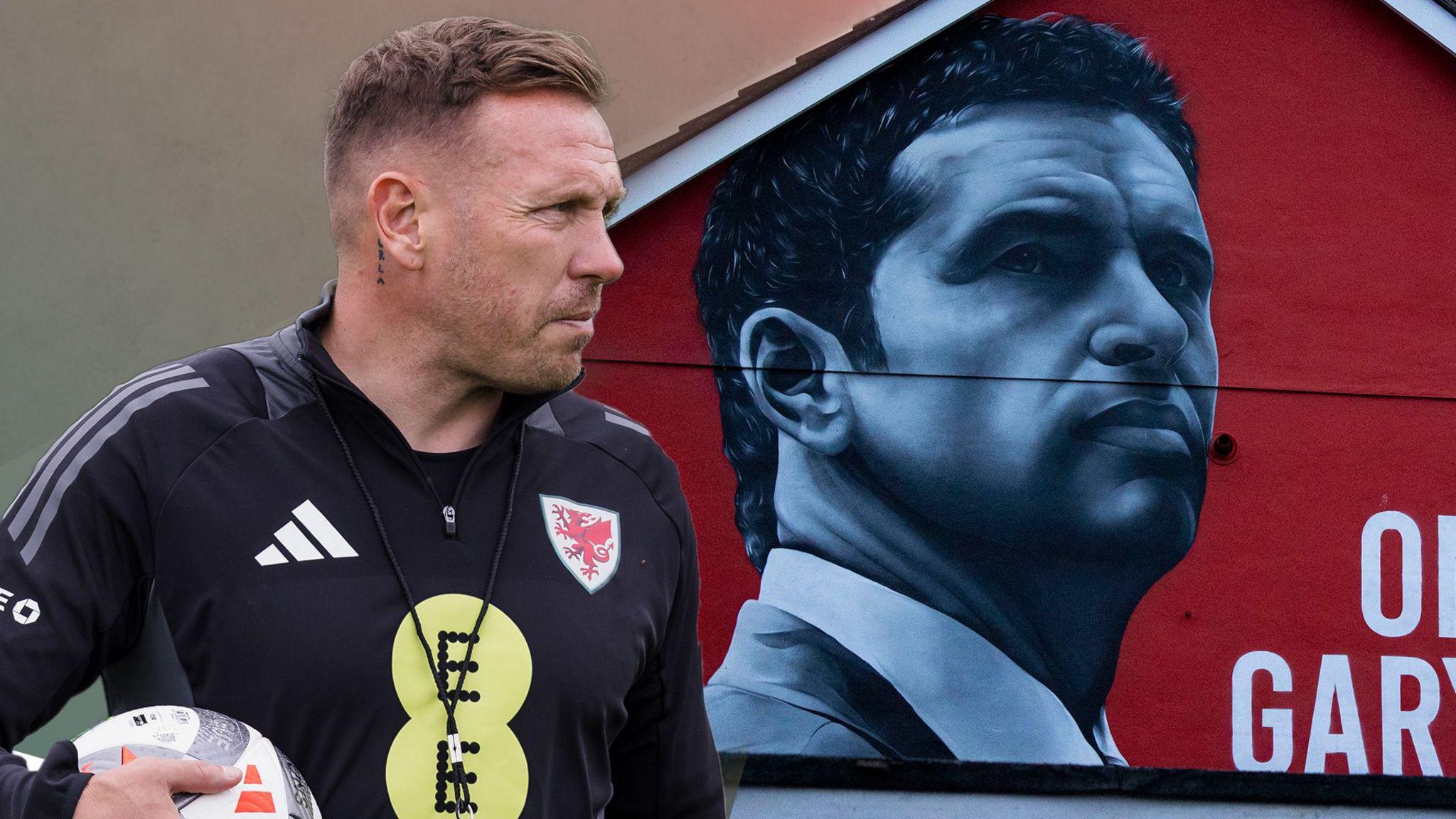 An image of Craig Bellamy with the Gary Speed mural behind him