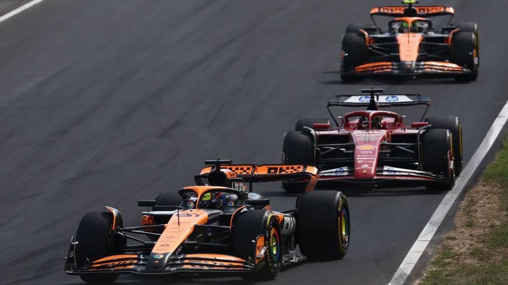 Oscar Piastri of McLaren, Charles Leclerc of Ferrari and Lando Norris of McLaren during the Formula 1 Italian Grand Prix