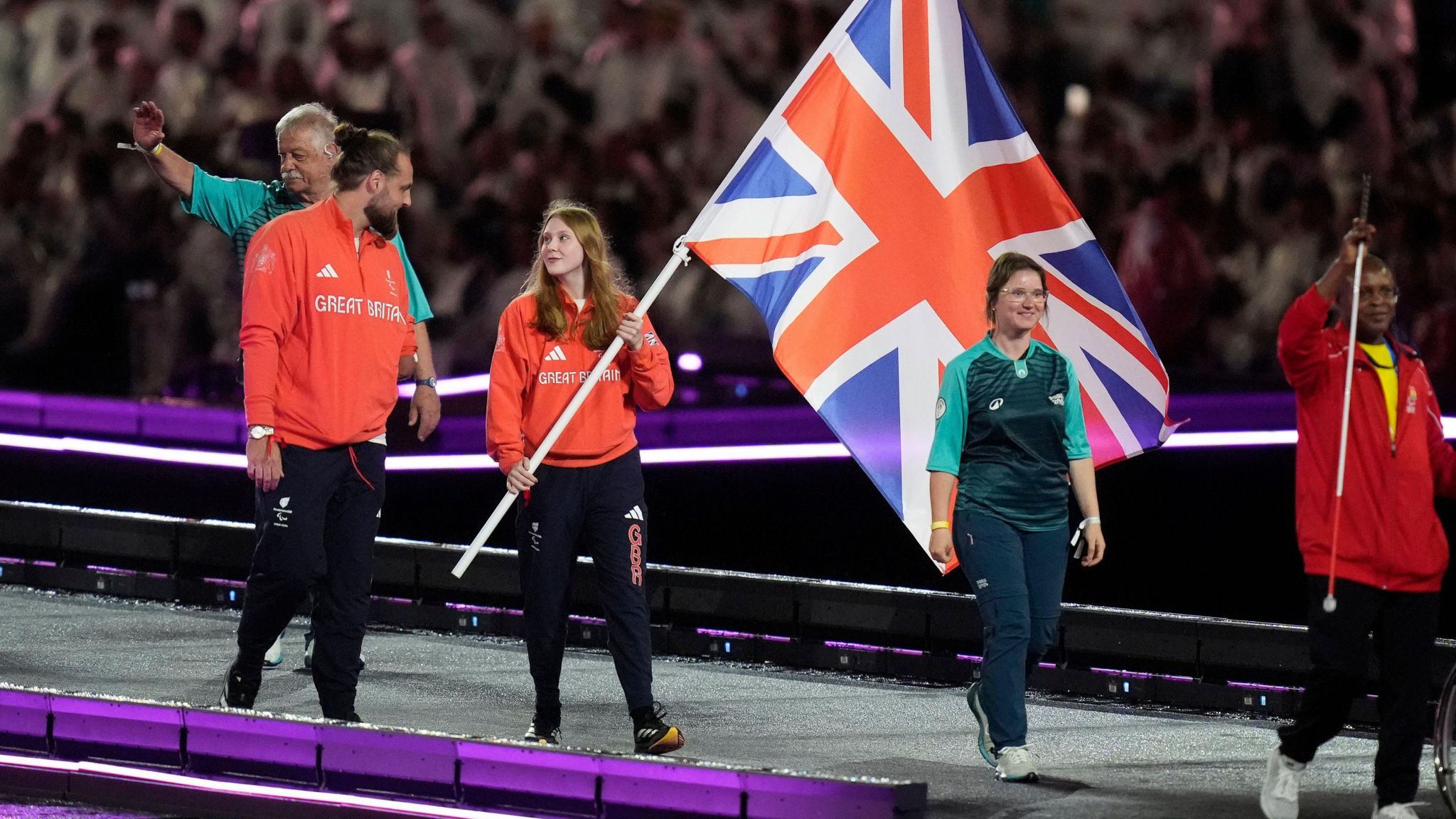 Great Britain’s Flag Bearers Matt Bush (left) and Poppy Maskill during the closing ceremony of the Paris 2024 Summer Paralympic Games