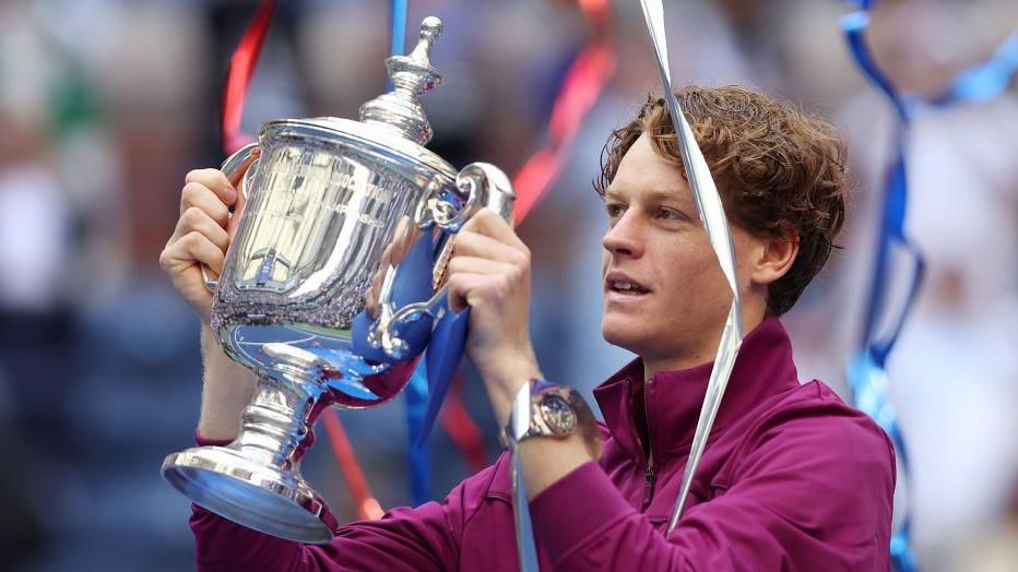 Jannik Sinner of Italy celebrates with the winners trophy after defeating Taylor Fritz